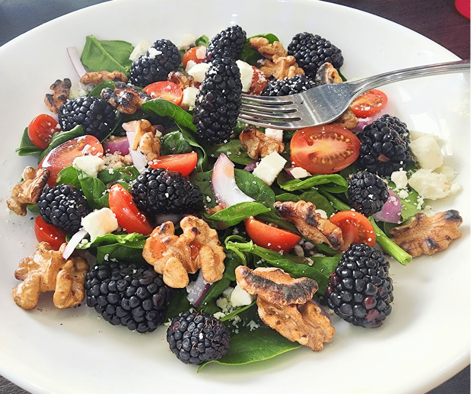 A refreshing summer salad with sweet berries, crisp greens, and a sprinkle of nuts.