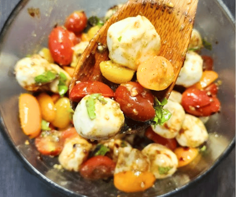 This Caprese Salad is rich with flavors of basil, tomatoes, and mozarella balls