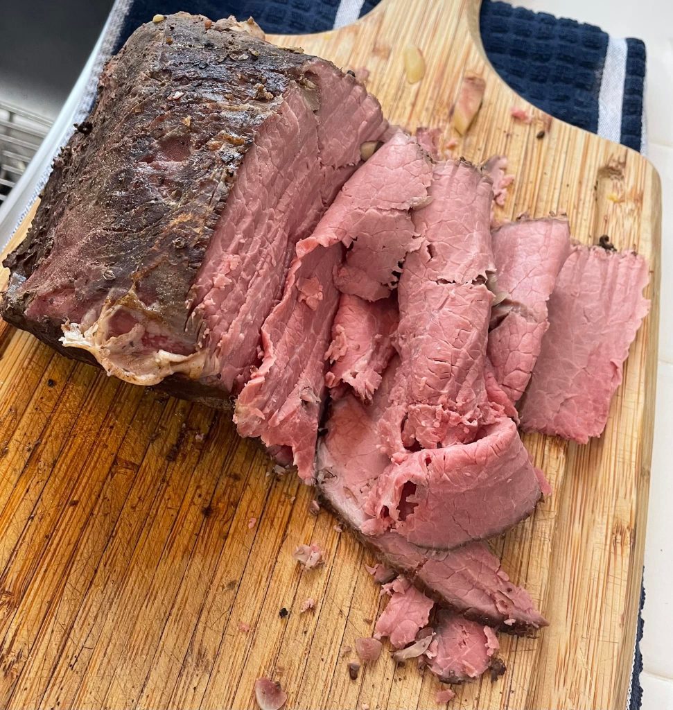 Perfectly cooked Easter roast beef, sliced thin from a lean bottom round roast