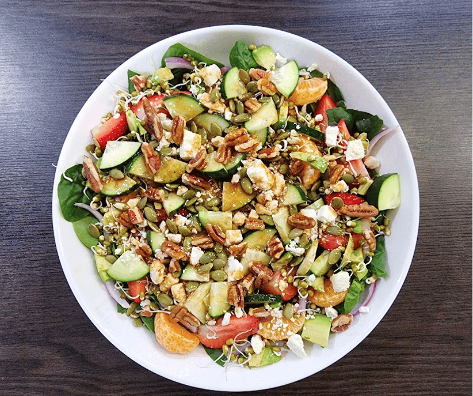 Bright strawberries and salty feta bring this fresh spinach salad to life.