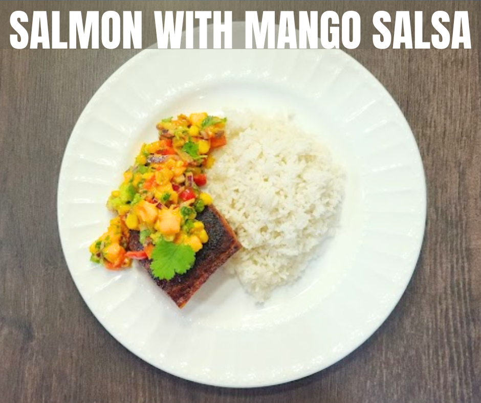Seared salmon topped with fresh mango salsa and rice on the side is a delicious meal