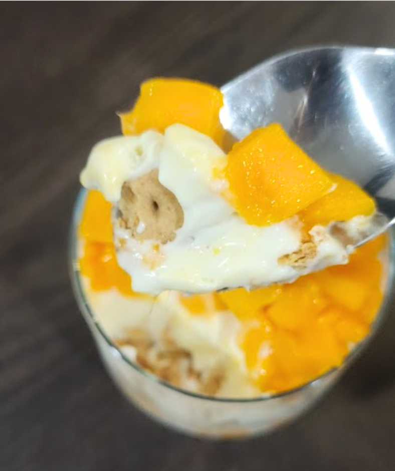 Creamy mango layers with soft graham cracker in every bite of this mango graham float.png