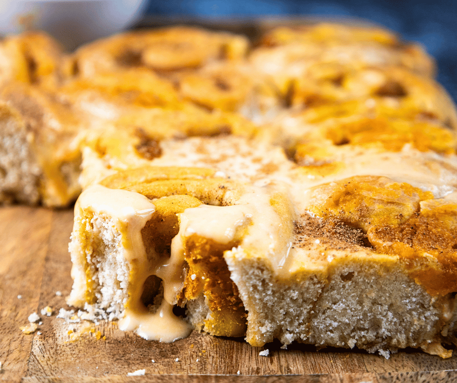 A close-up of the soft, spiced center of a pumpkin cinnamon roll.