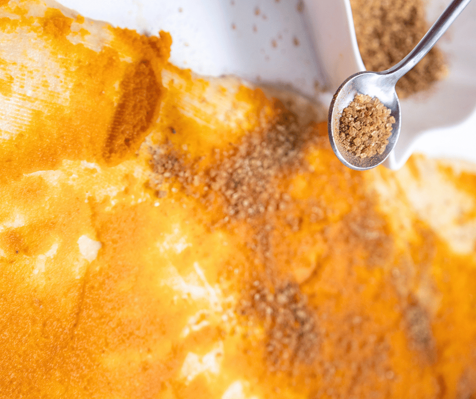 Generously spread pumpkin puree and spices before rolling the dough into a log and cutting it into pumpkin rolls