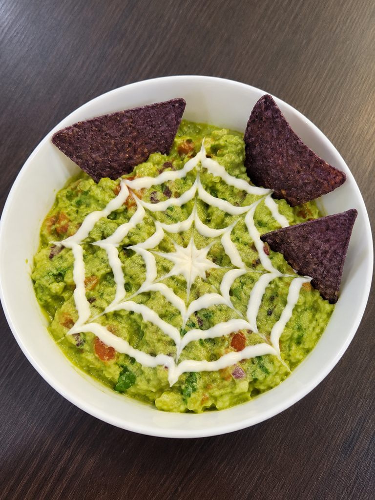 This guac sour cream spiderweb hack is so easy to do for Halloween